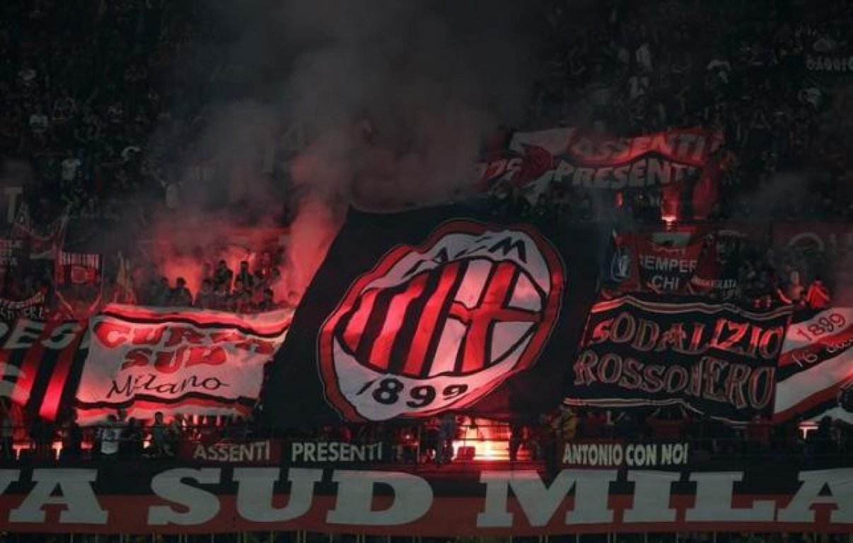 ac-milan-fans-light-flares-during-the-teams-italian-seria-a-soccer-match-against-inter-milan-at-san-siro-stadium-in-milan-may-2014