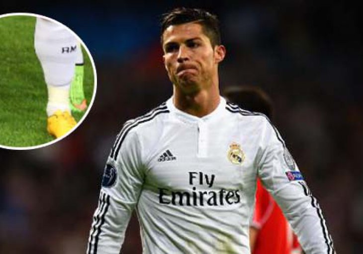 Cristiano Ronaldo stoji na prstima da izgleda viši