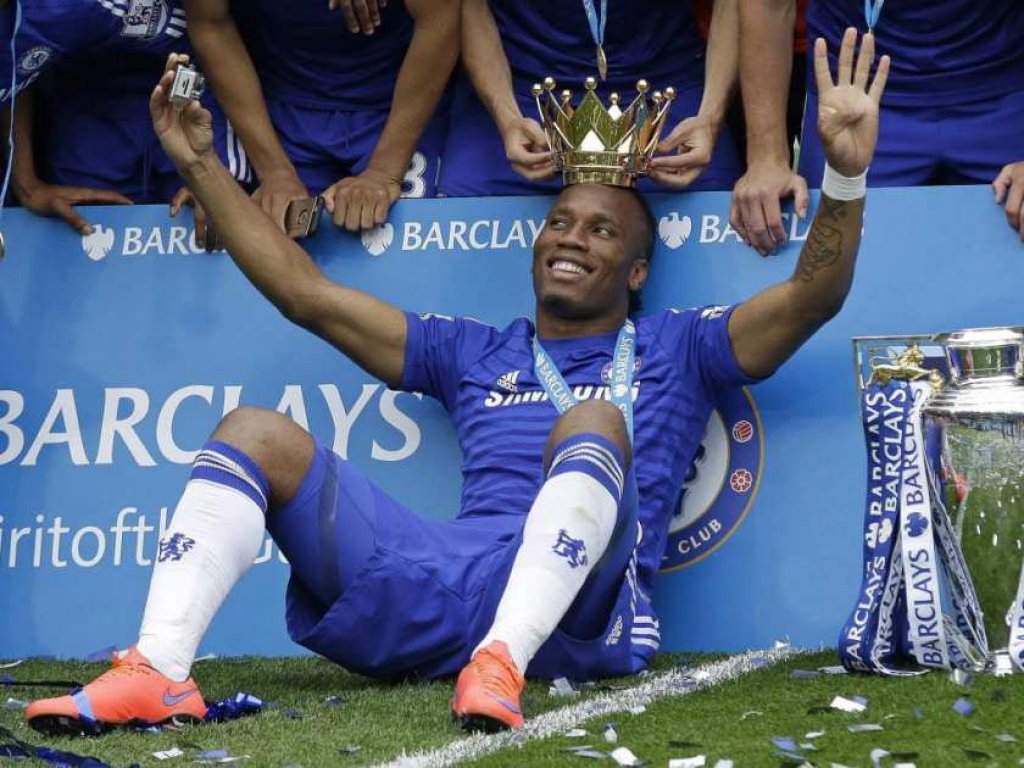 the-crown-of-the-trophy-is-placed-on-the-head-of-didier-drog