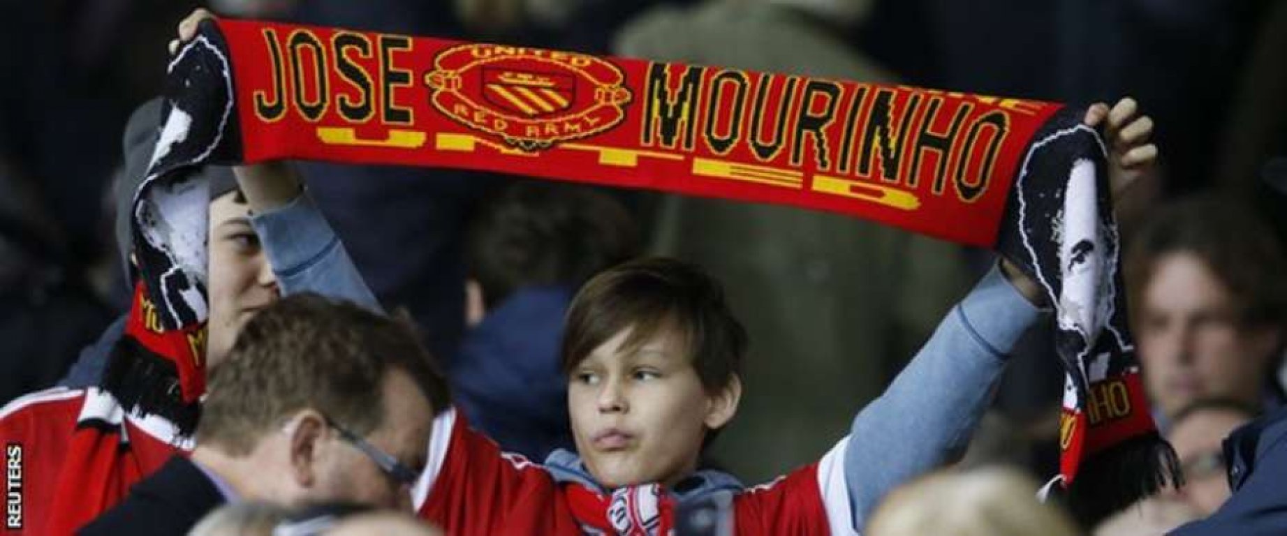 88138972-manutdfanwithmourinhoscarf-getty