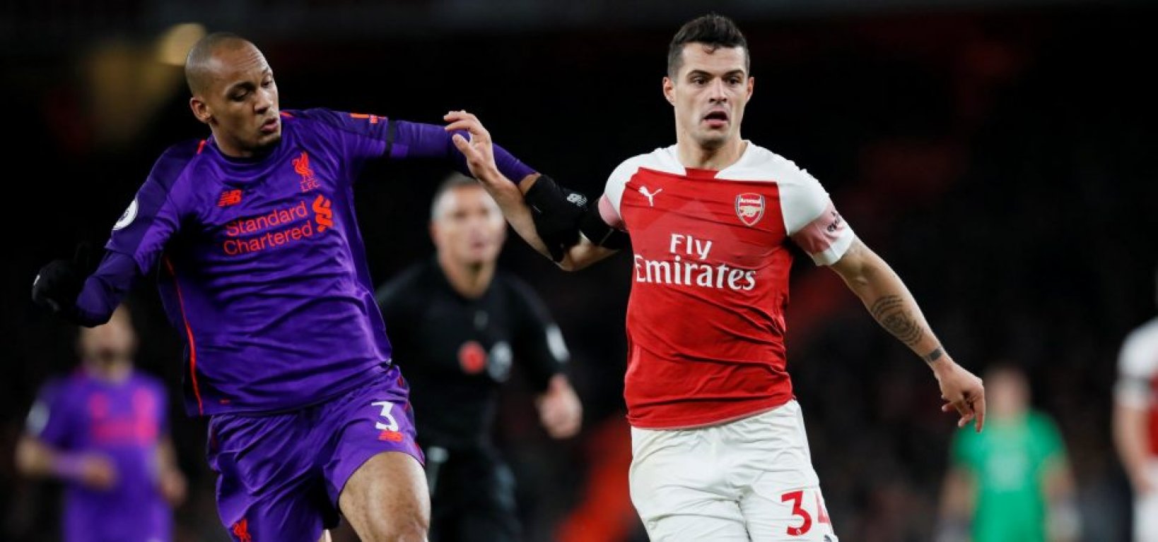 fabinho-challenges-granit-xhaka-for-the-ball-during-arsenal-v-liverpool-960x450